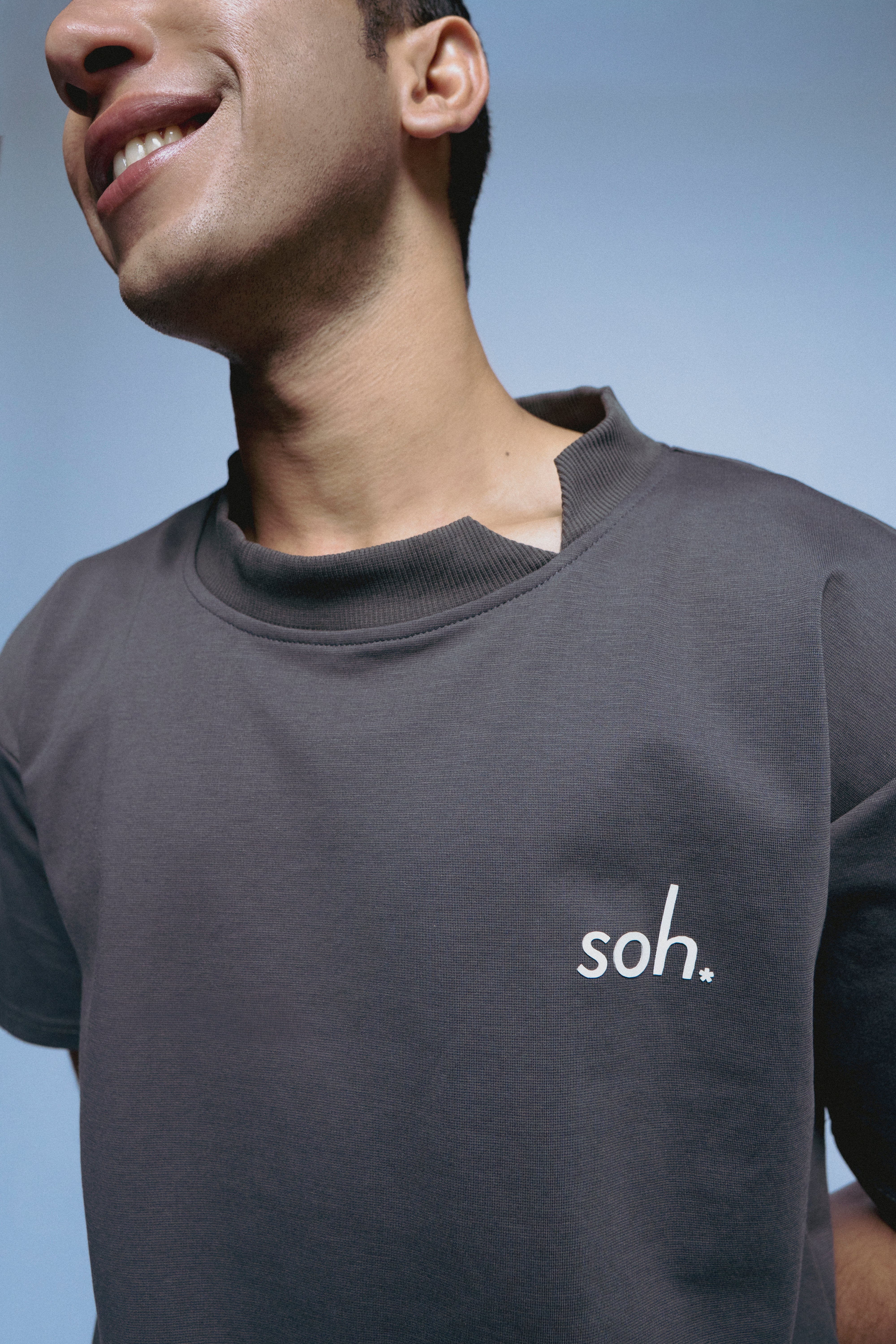 Man wearing a gray SOH Question T-shirt 